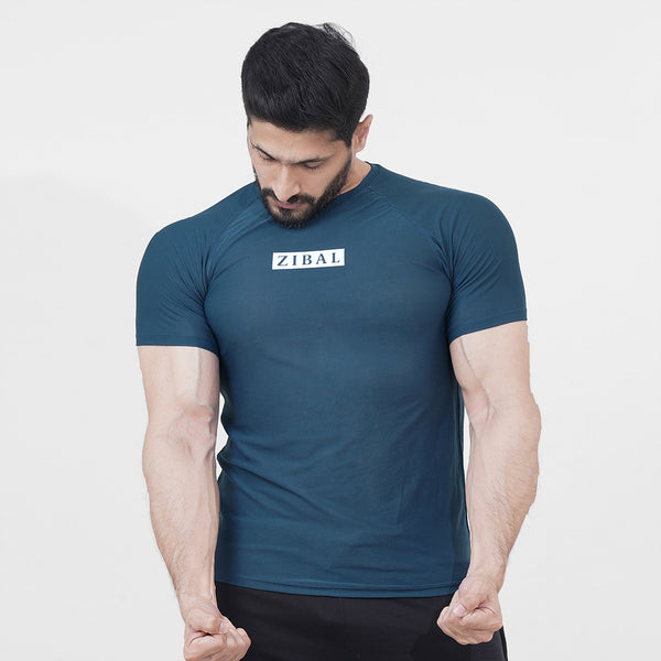 Revolve Compression Tee in Teal Blue